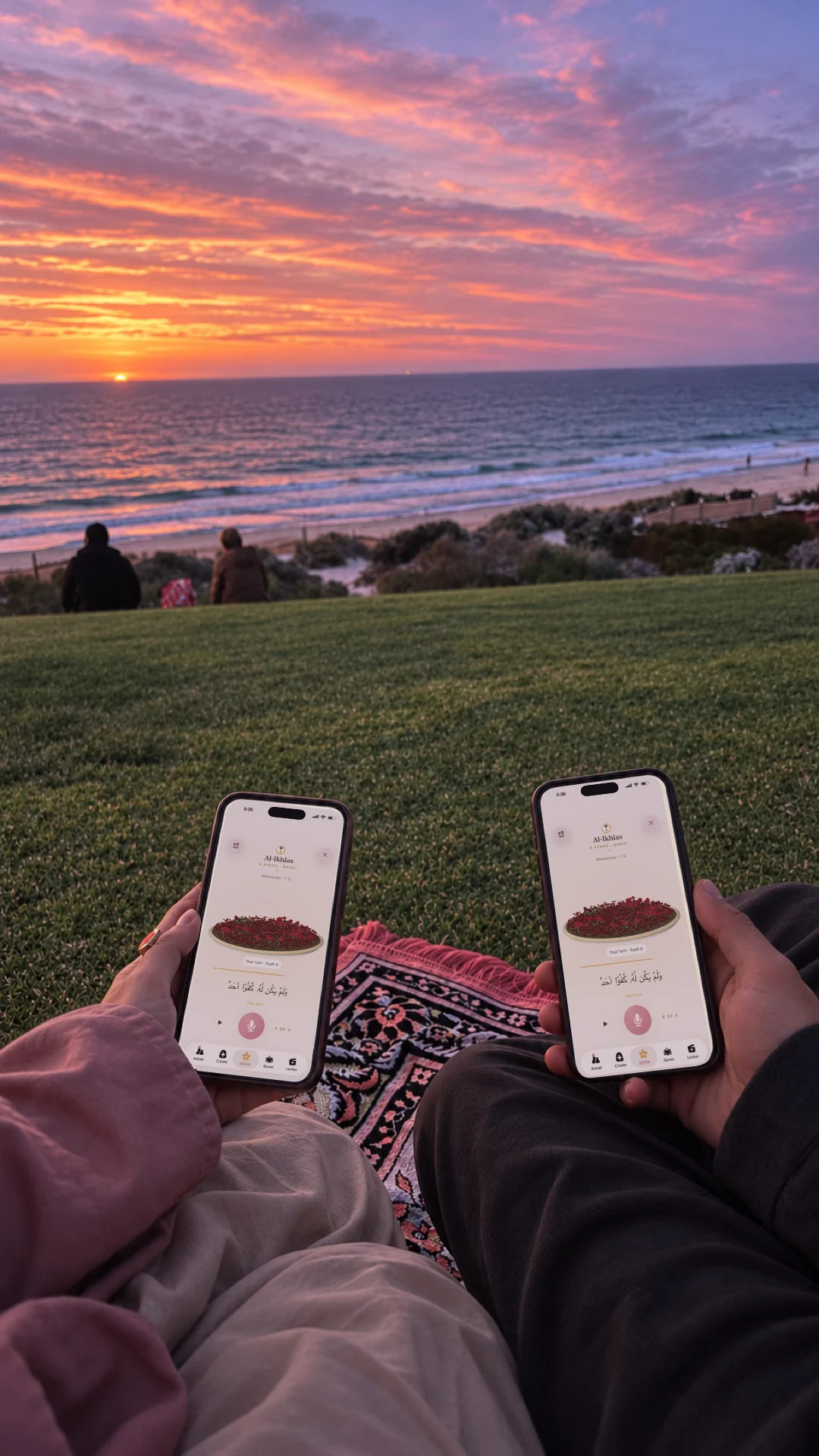 Two people seated side by side looking toward a seaside sunset, with Hablobi garden screens on their phones.